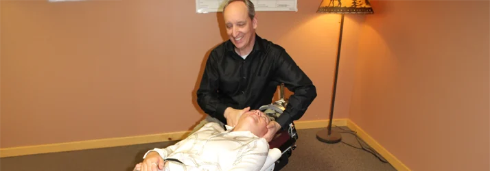 Dr. Murvich adjusting a patient's neck